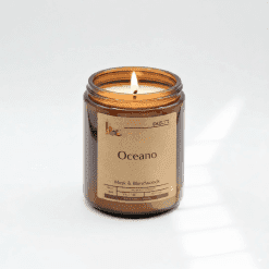 Amber jar candle with lit wick