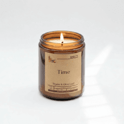 Scented candle with thyme and olive leaf
