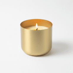 Natural beeswax and cocoa butter candle in a gold tin with wooden wick