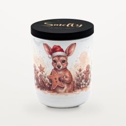 Smelty Christmas candle in a white ceramic jar with a black wooden lid and gold Smelty logo, printed with a young kangaroo in a Santa hat holding a large iced gingerbread star, surrounded by gingerbread men, cinnamon sticks and star anise.