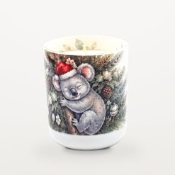 Koala Pine candle with the lid off, showing the candle inside and watercolour eucalyptus leaves printed around the inside rim of the jar.