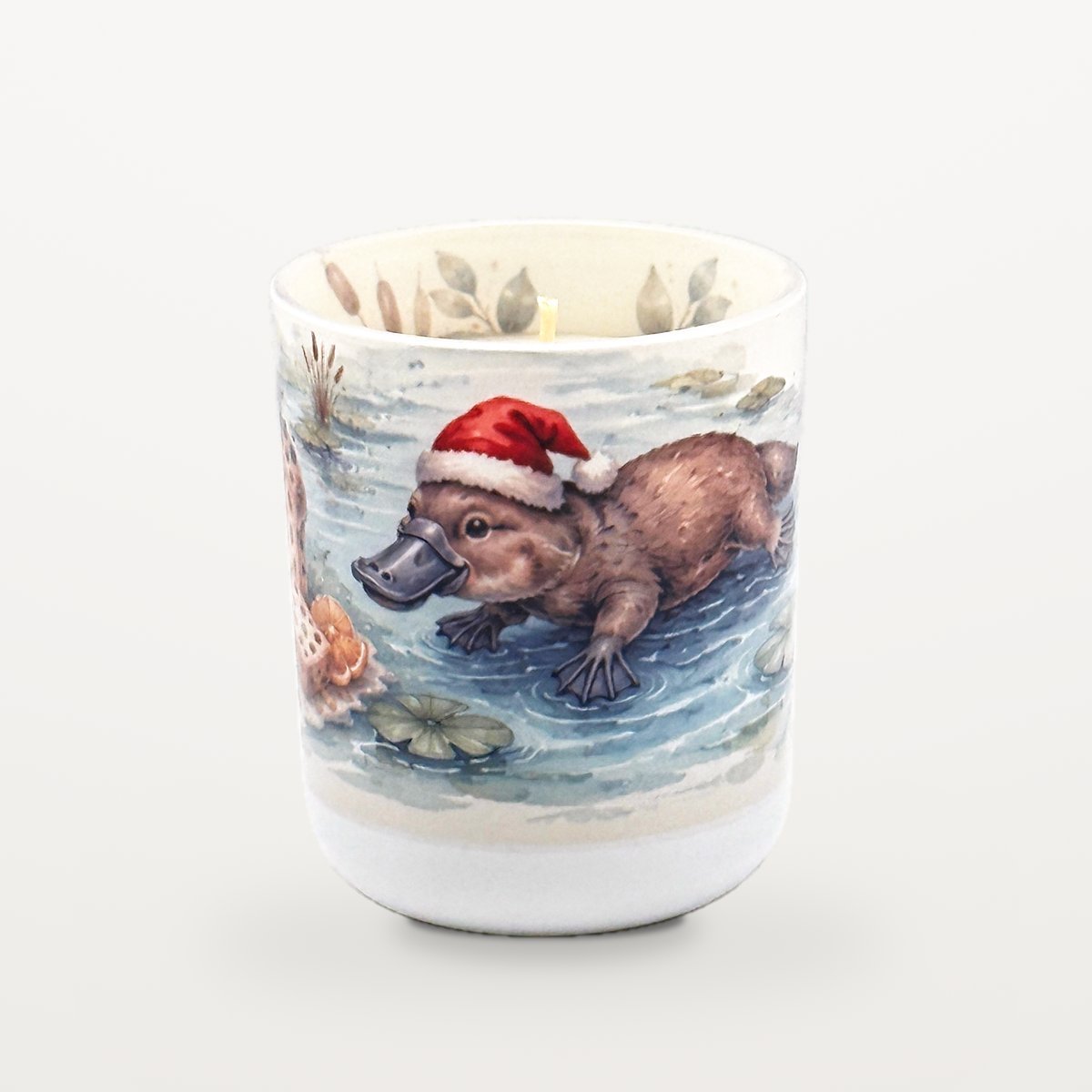 Platypus – Panettone &Amp; Fruits 2 Platypus Panettone Candle With The Lid Off, Showing The Candle Inside And Watercolour Eucalyptus Leaves Printed Around The Inside Rim Of The Jar.