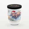 Platypus – Panettone &Amp; Fruits 7 Smelty Christmas Candle In A White Ceramic Jar With A Black Wooden Lid And Gold Smelty Logo, Printed With A Platypus In A Santa Hat Paddling In A Pond Among Lily Pads And Reeds.