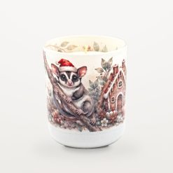 Sugar Glider Gingerbread candle with the lid off, showing the candle inside and watercolour eucalyptus leaves printed around the inside rim of the jar.