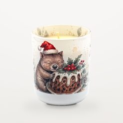 Wombat Christmas Pudding candle with the lid off, showing the candle inside and watercolour eucalyptus leaves printed around the inside rim of the jar.