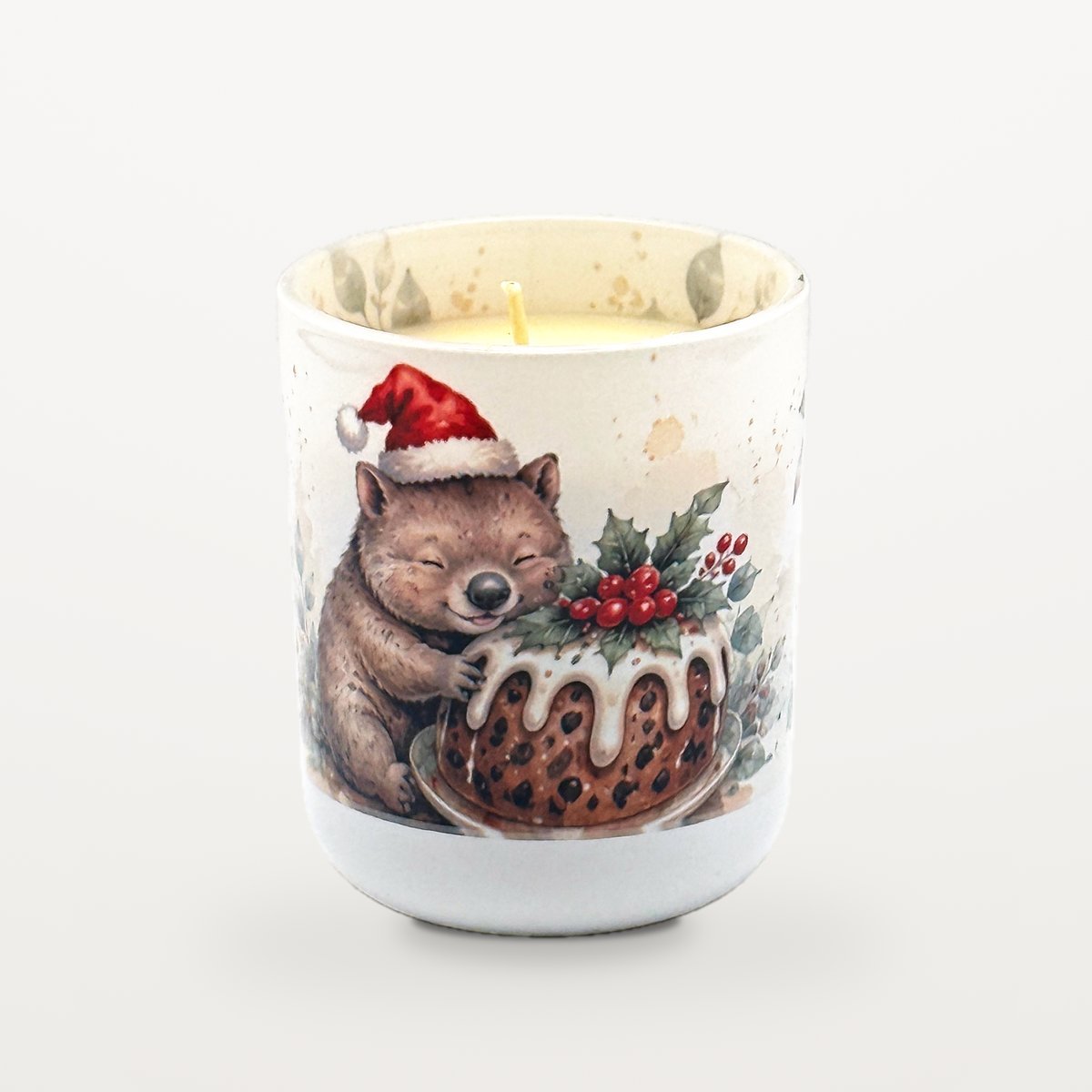Wombat – Christmas Pudding 2 Wombat Christmas Pudding Candle With The Lid Off, Showing The Candle Inside And Watercolour Eucalyptus Leaves Printed Around The Inside Rim Of The Jar.